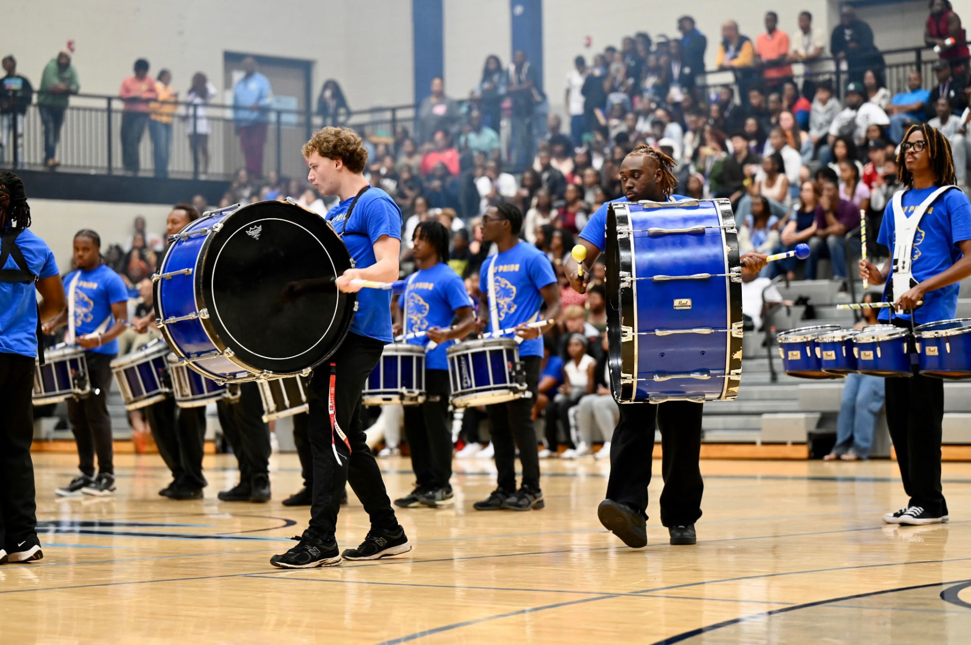 The OU P.R.I.D.E. Percussion performing in the gymnasium